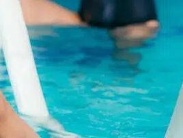 low-section-swimmers-exercising-swimming-pool_1048944-19945393-1